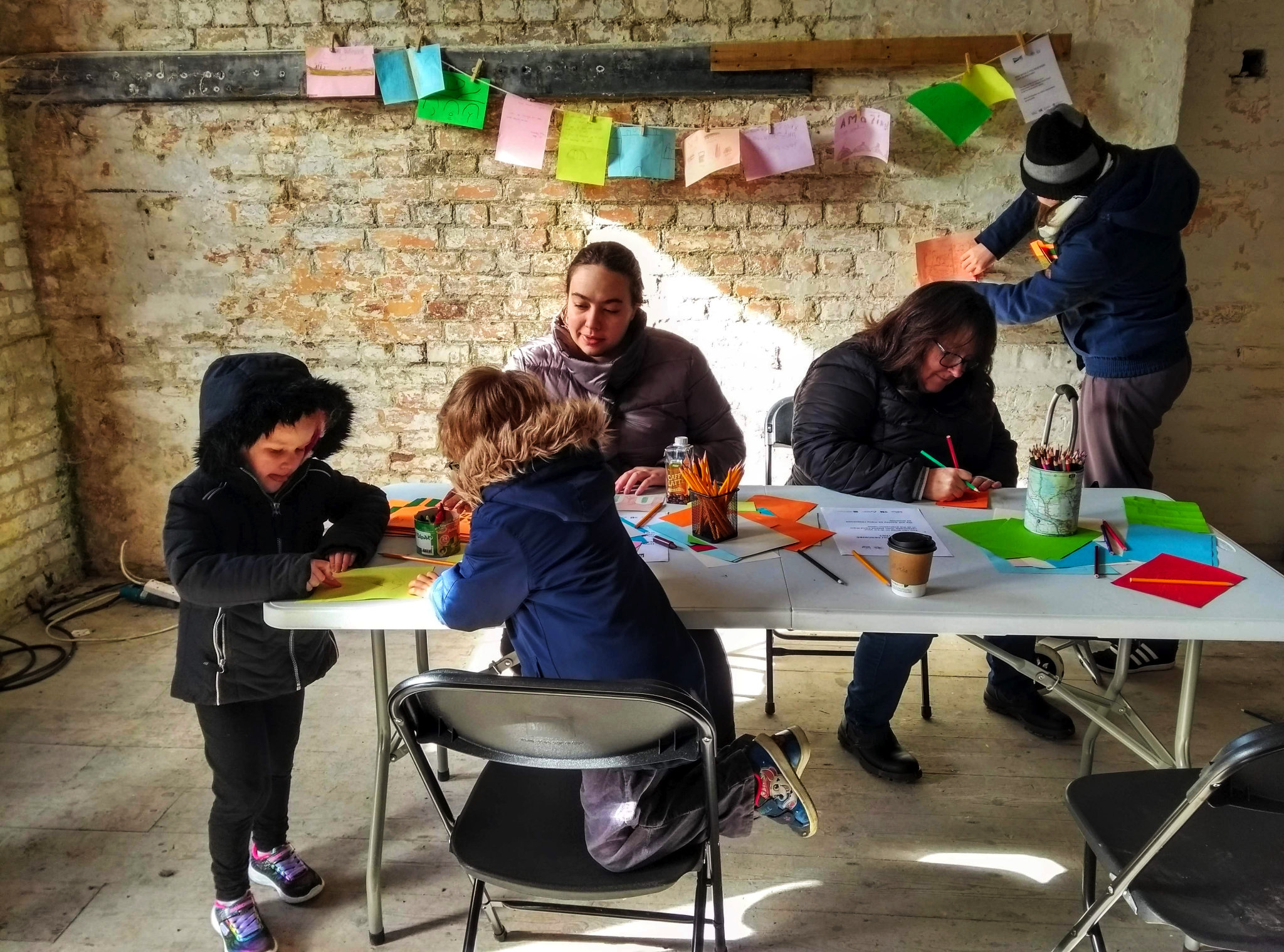 Mothers with children busy creating art in a workshop in Fort Burgoyne, Dover